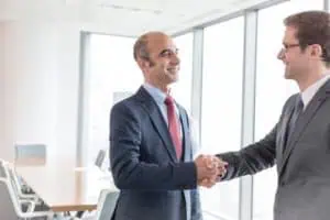 two businessmen shaking hands