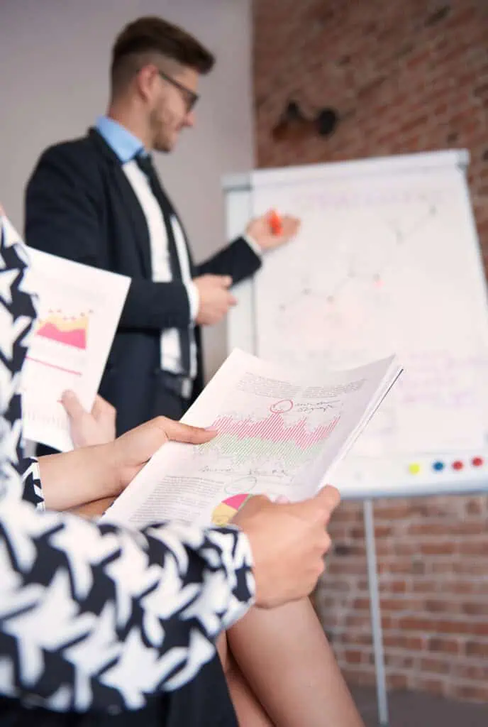 Meeting about reports with man explaining the data