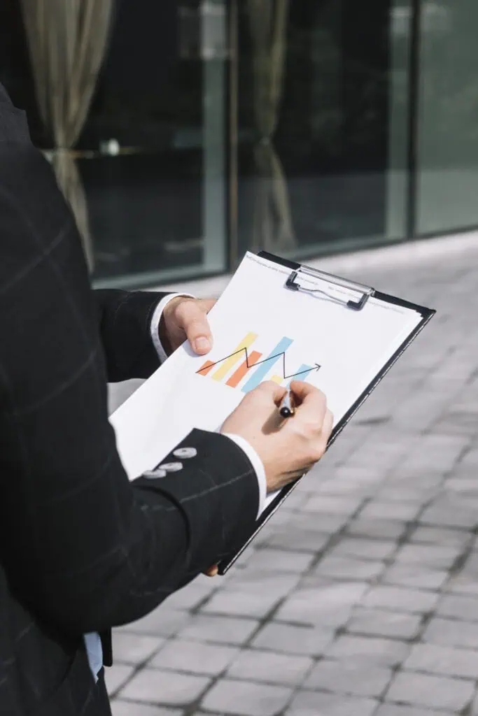 Man holding chart controling the graphs